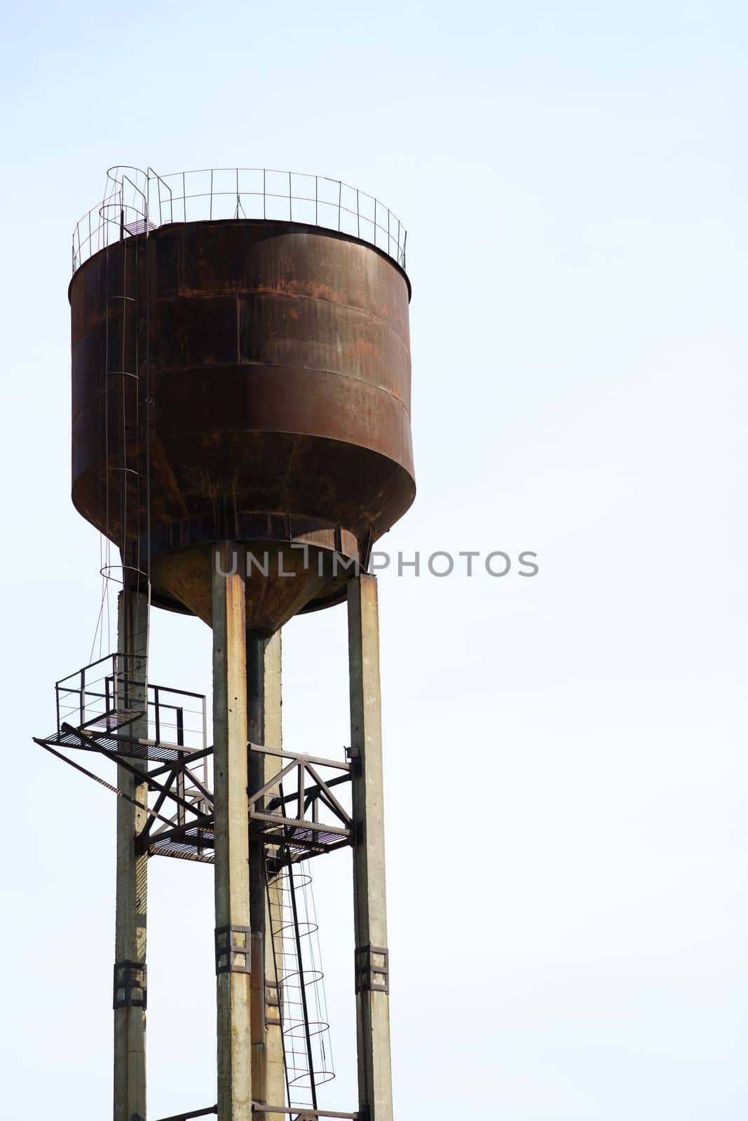 a large water tower on the background of the sky. High quality photo