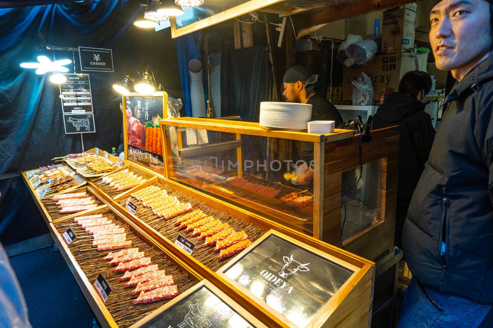 Tokyio, Japan. January 2024. preparing food at stalls at the Tsukiji Outer Market in the city centre