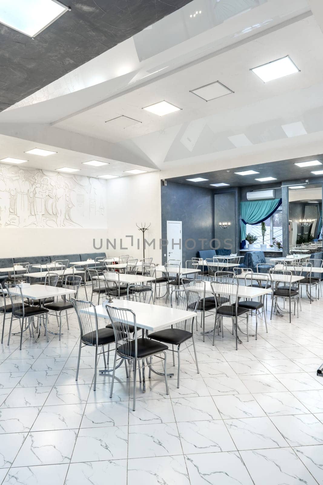 Interior of light colored canteen at the business center no people