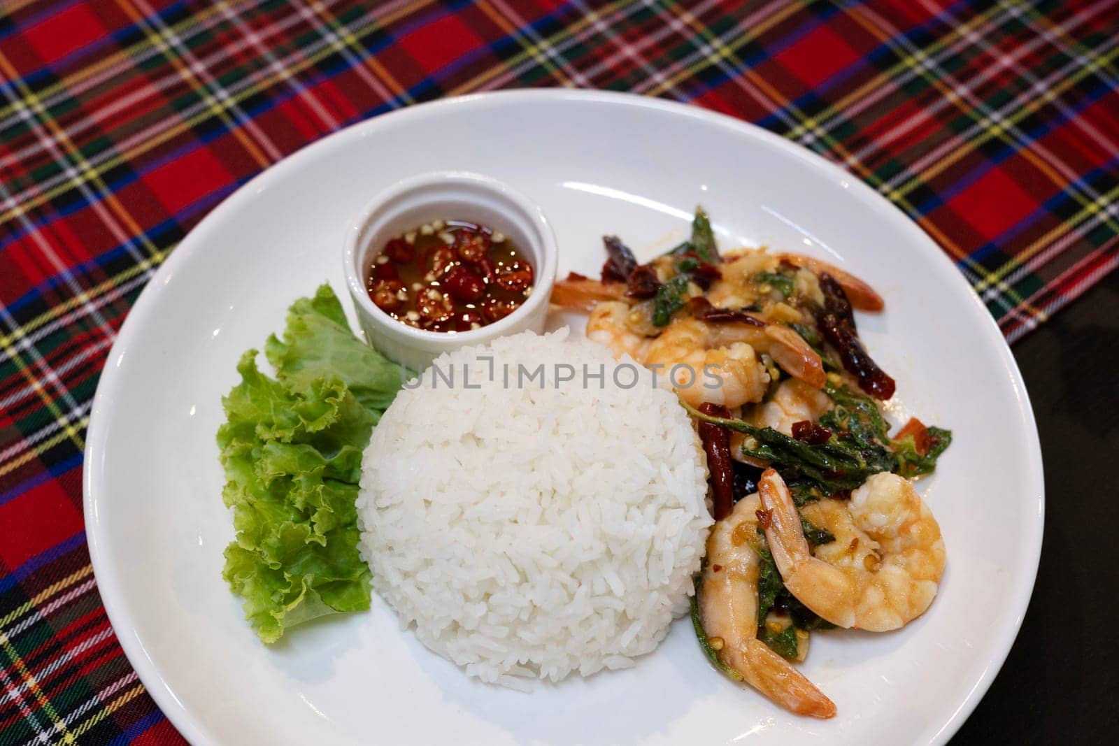 Rice and stir-fried shrimps with Thai basil. Asian food style.