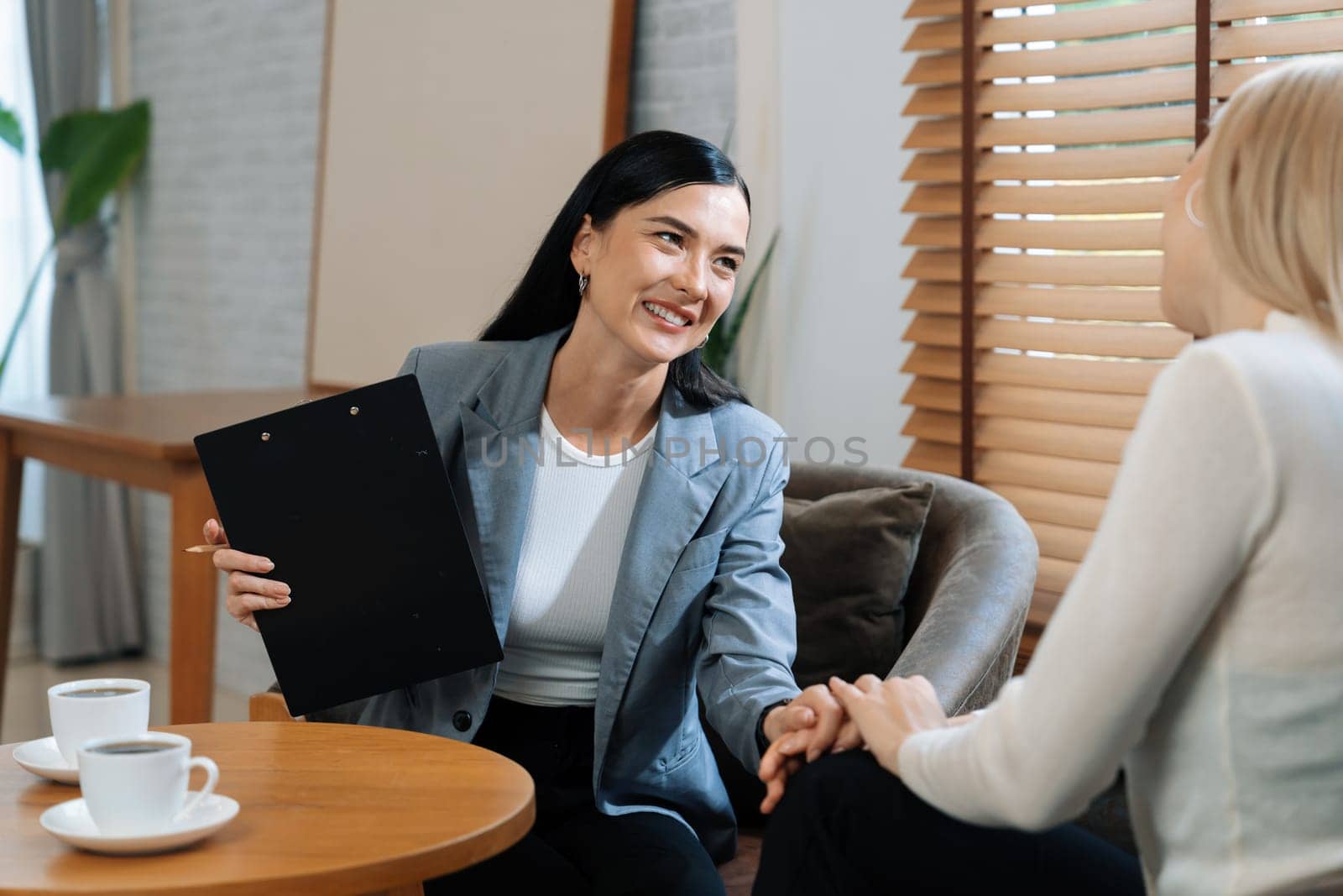 Psychological consultation gaining improvement on mental problem, happy young female patient getting better during therapy session while psychiatrist making diagnostic on mental illness. Blithe