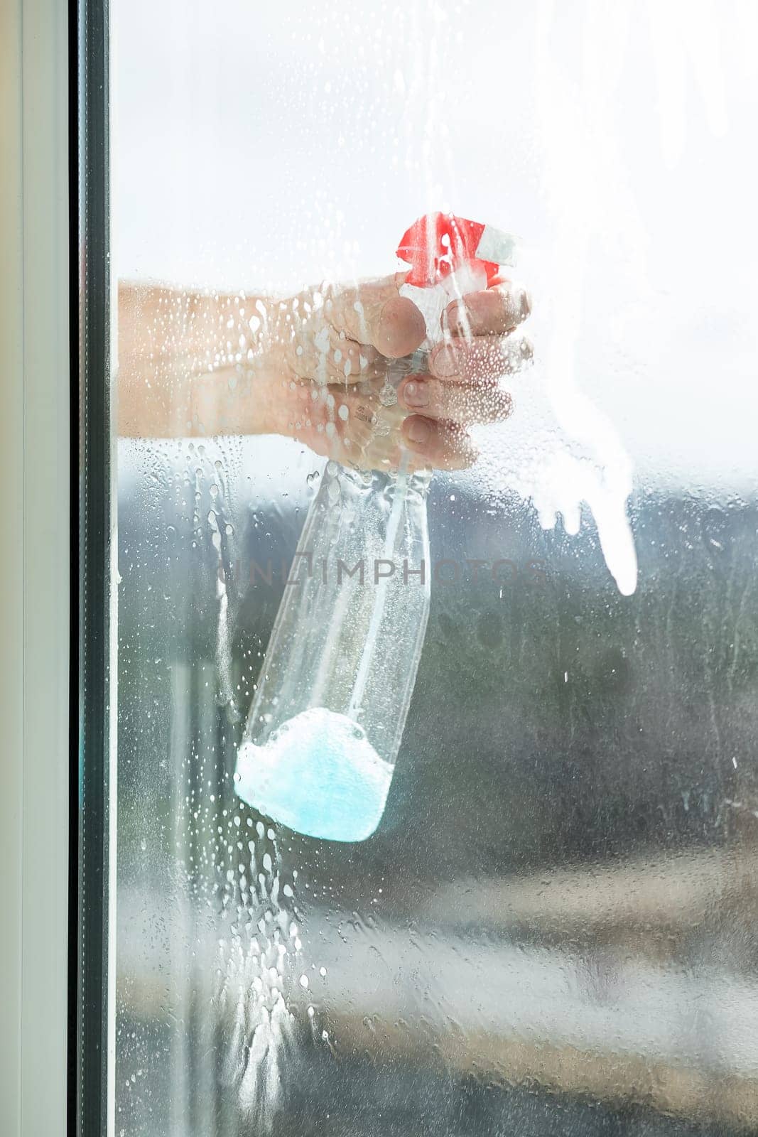 Cleaning windows with special rag and cleaner