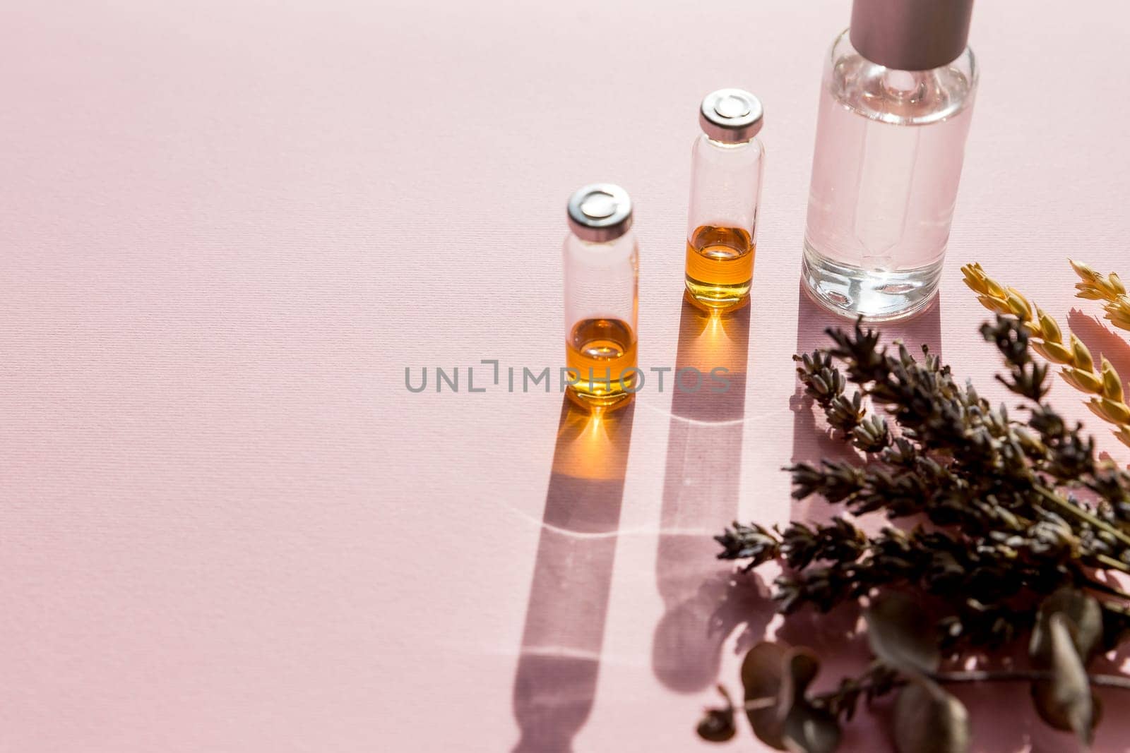 Natural cosmetics with lavender and orange, lemon for homemade spa on white background top view mock up.Bottle with aroma oil. Selective focus. Face and body care. Copy space by YuliaYaspe1979