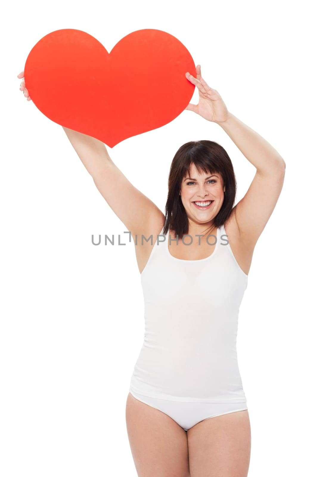 Portrait, heart and happy plus size woman in studio isolated on a white background. Love, sign or symbol of model in underwear with healthy body for care, kindness emoji and romance on valentines day.