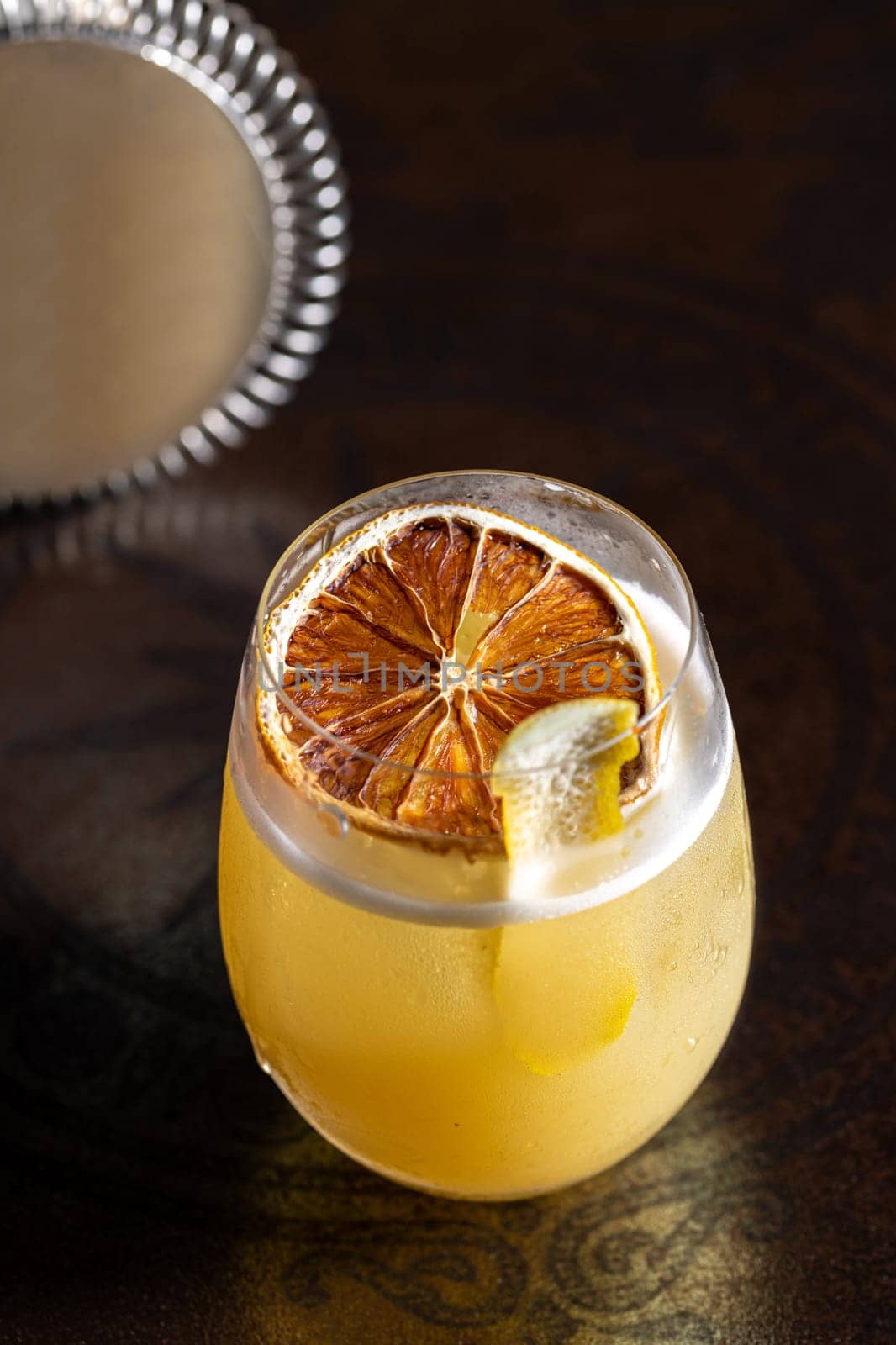 Luxury cocktail on the wooden table on a dark background