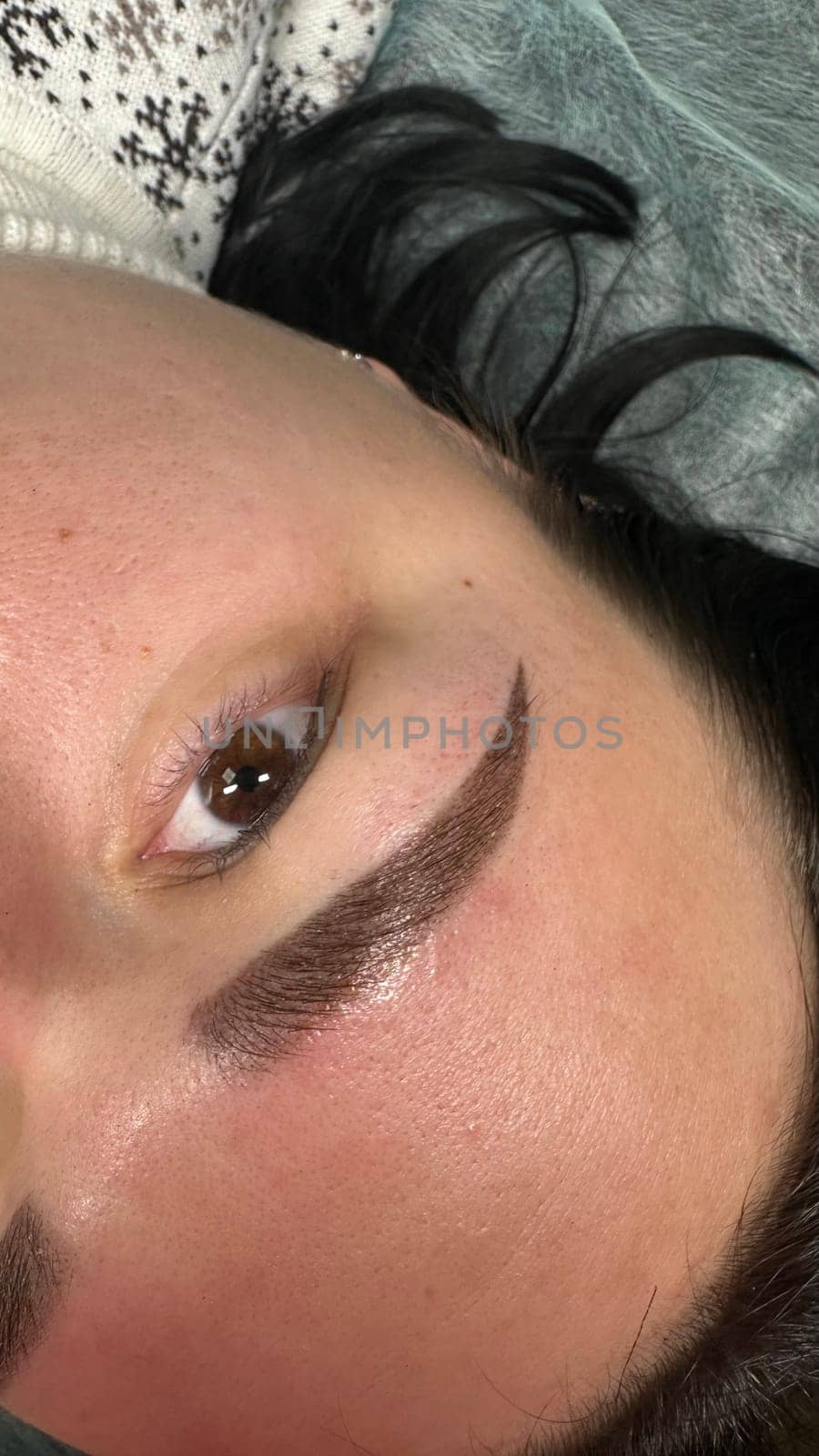 Close up view of beautiful brown female eye. Perfect trendy eyebrow. Good vision, contact lenses, brow bar or fashion eyebrow makeup concept. High quality photo