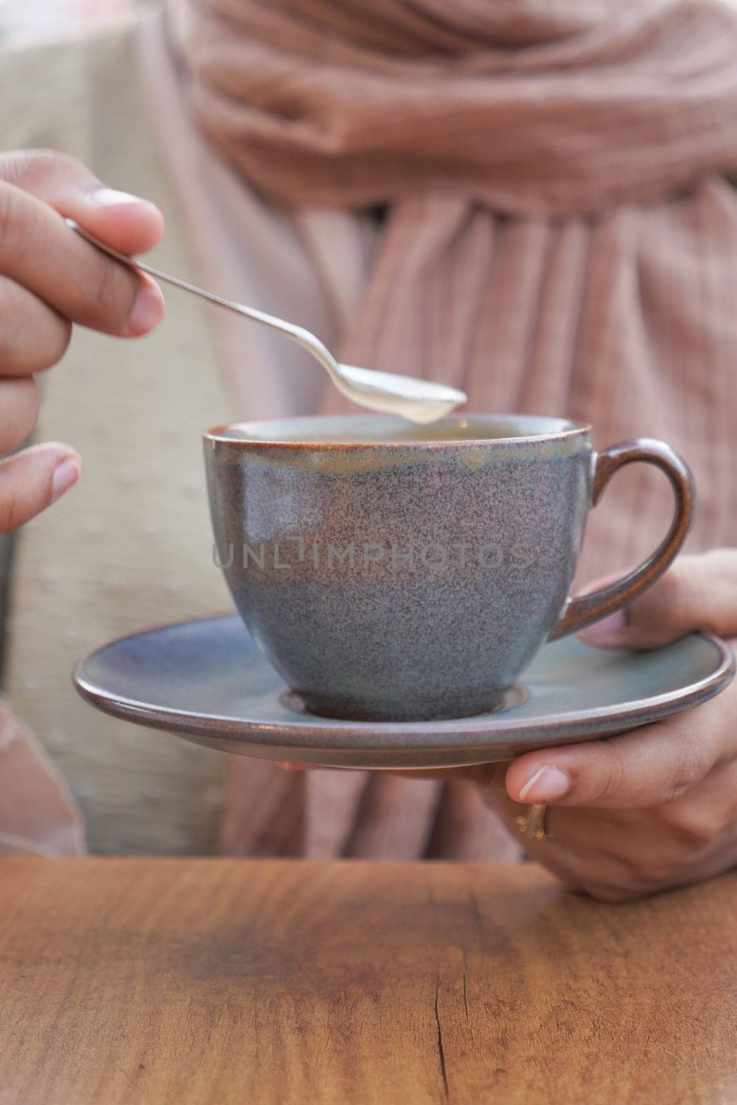 women holding a coffee cup .