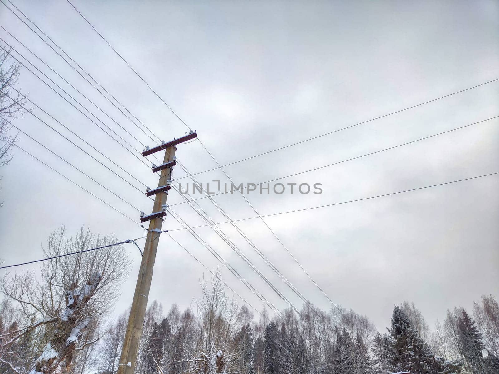 Old pole with wires against the sky. Electric transmission line, Eco-friendly energy