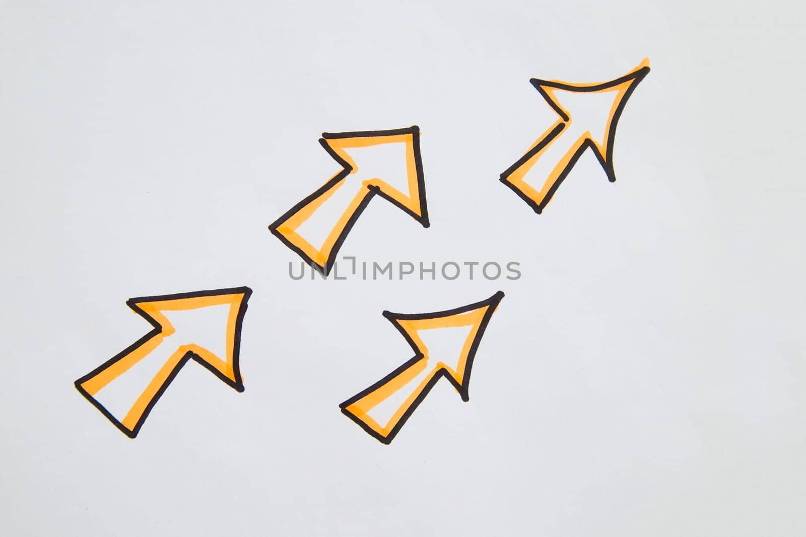 Pack drawn black marker arrows. The concept of business, choosing direction, moving forward. Abstract sign, background, texture. Partial focus, blur