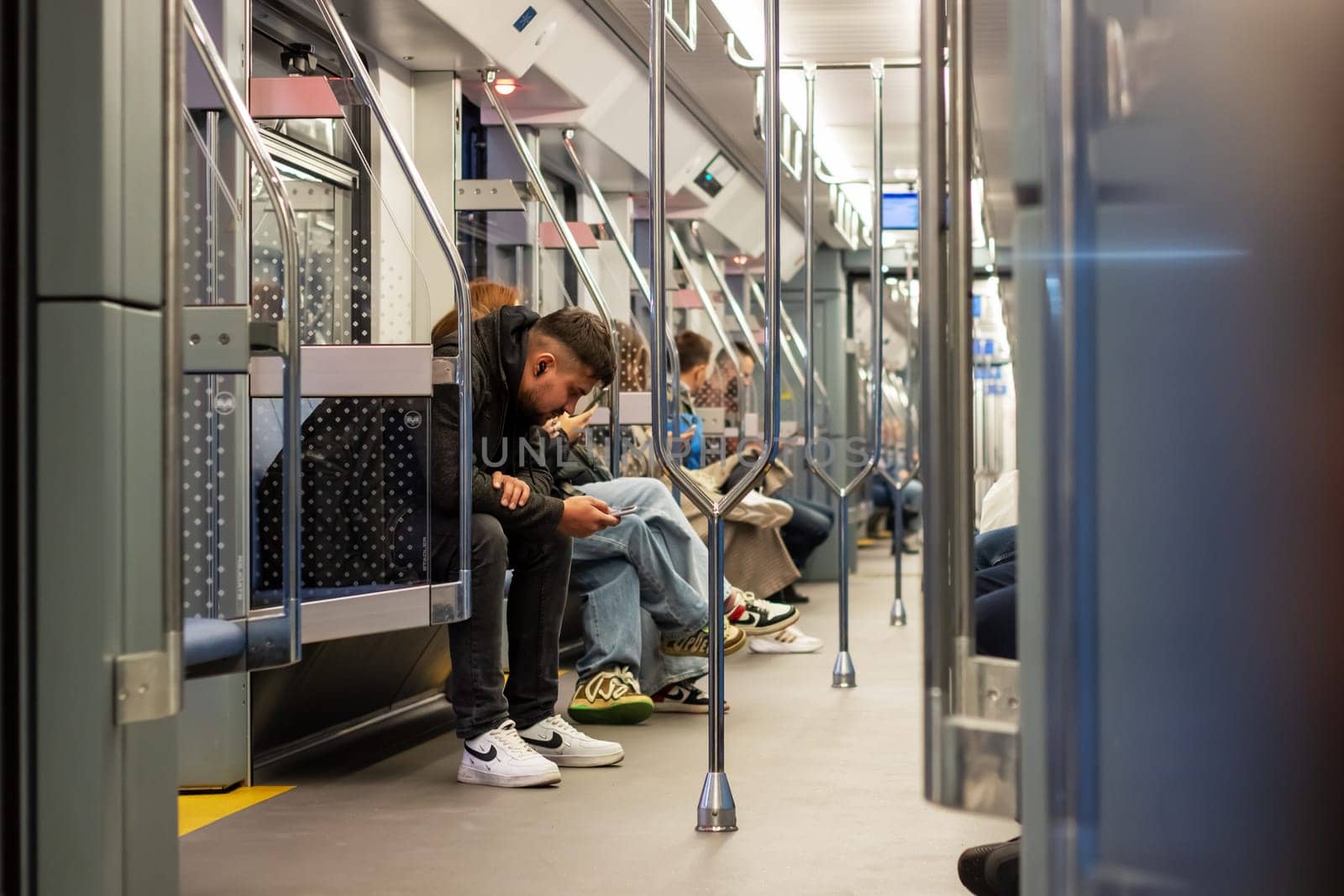 Minsk, Belarus - 9 september, 2023: People in a subway car close up