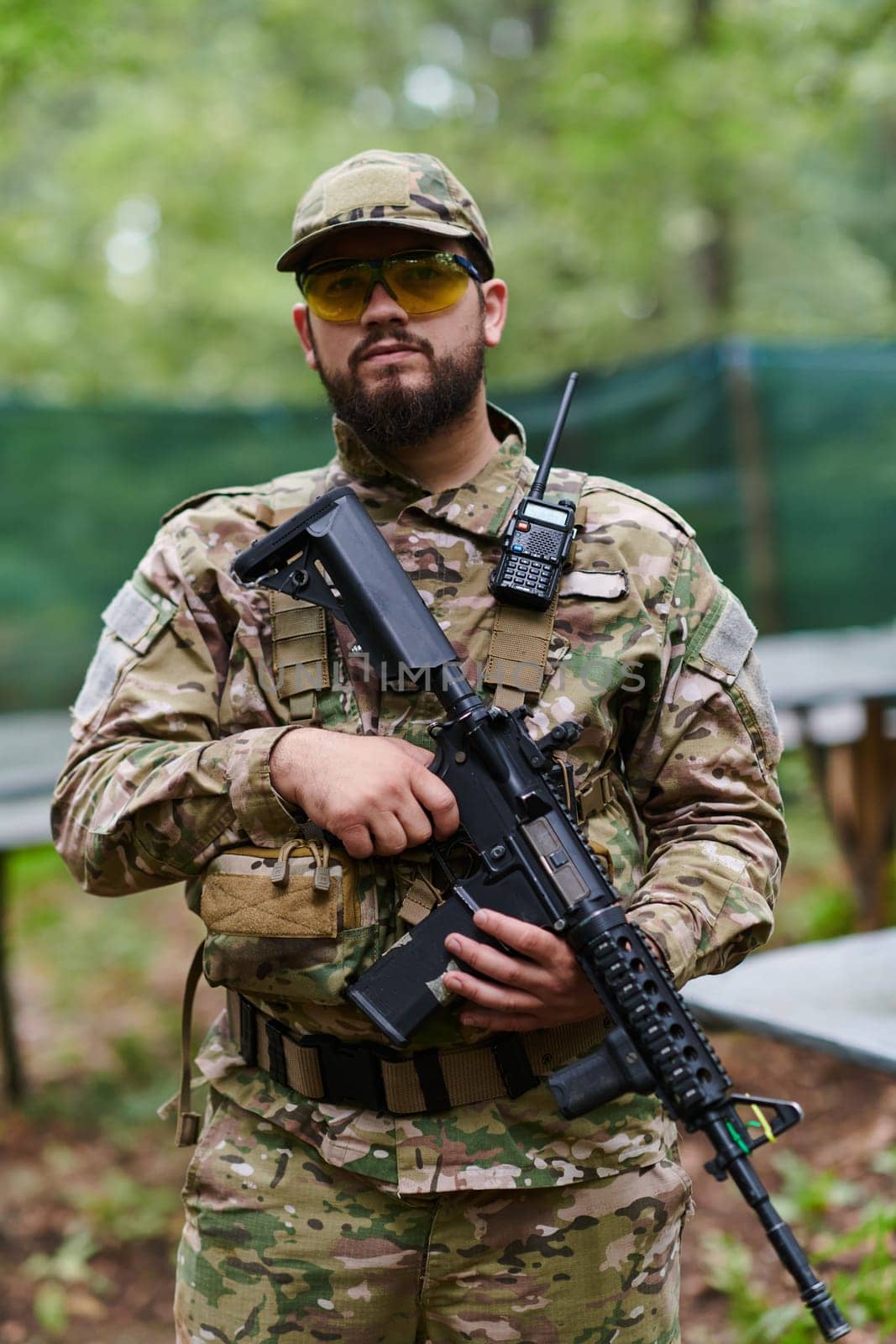 Elite soldier exudes focused determination and readiness, geared up for a perilous military operation, capturing the essence of courage and professionalism in the face of imminent danger.