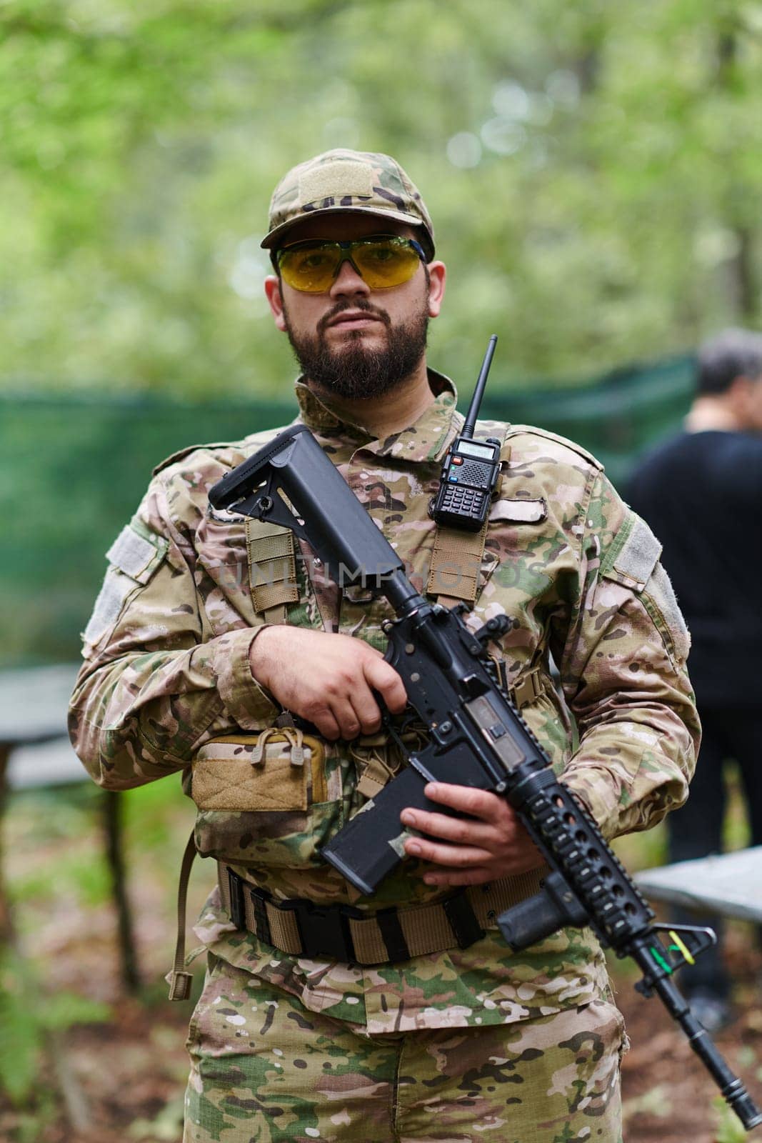 Elite soldier exudes focused determination and readiness, geared up for a perilous military operation, capturing the essence of courage and professionalism in the face of imminent danger.