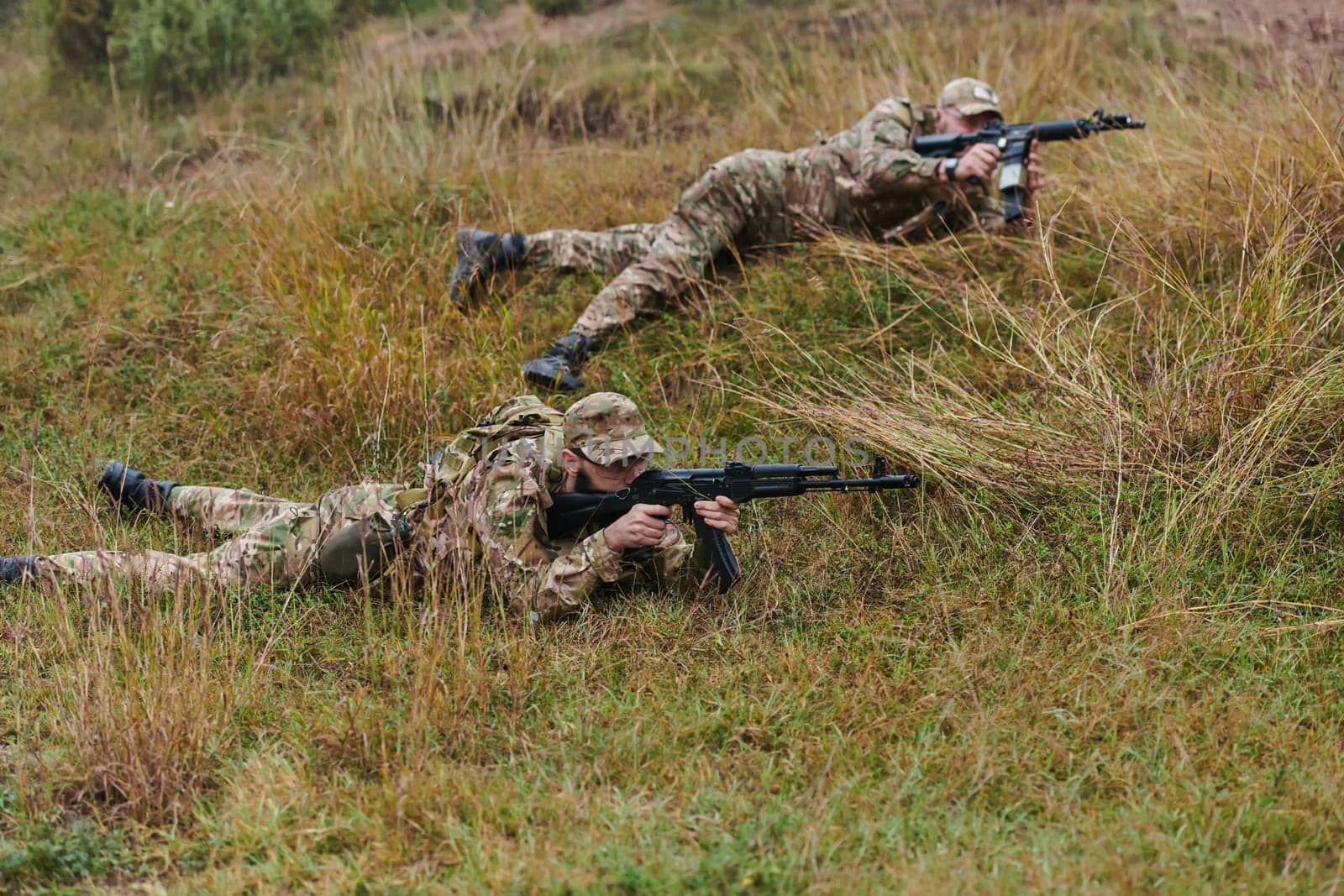 Elite soldiers stealthily maneuver through the dense forest, camouflaged in specialized gear, as they embark on a covert and strategic military mission.