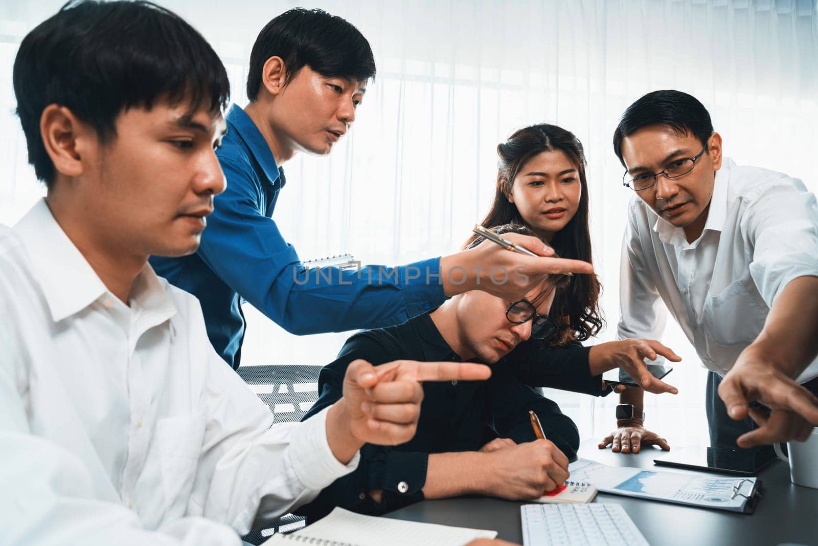 Group of diverse office worker employee working together on strategic business marketing planning in corporate office room. Positive teamwork in business workplace concept. Prudent