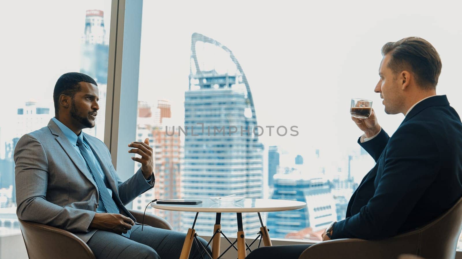 Ornament office with cityscape view, business college or MBA student discussing their future career path at coffee break. Corporate consultant guiding business insight and idea for client.