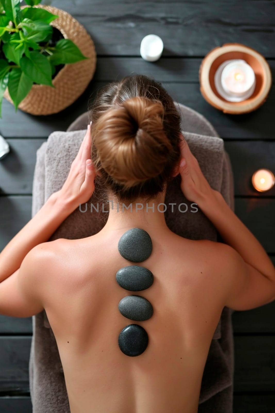 Woman in spa salon stones. Selective focus. by yanadjana