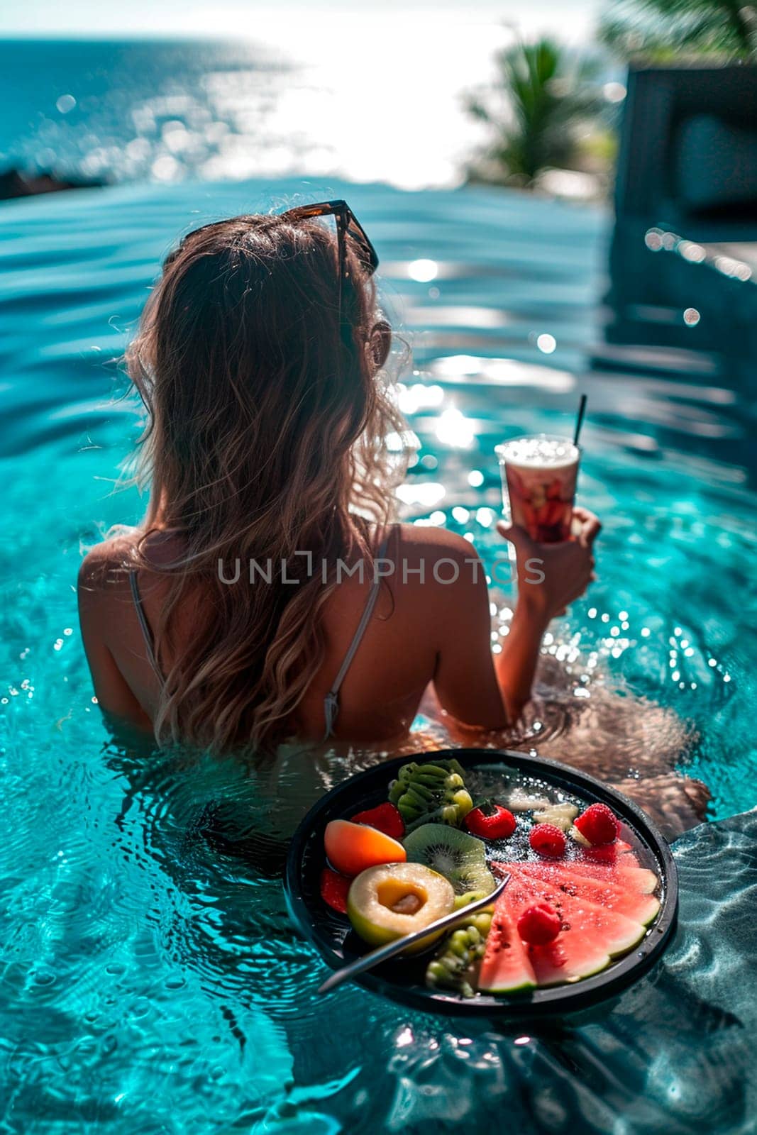 woman in the pool with fruit and cocktail. Selective focus. nature.