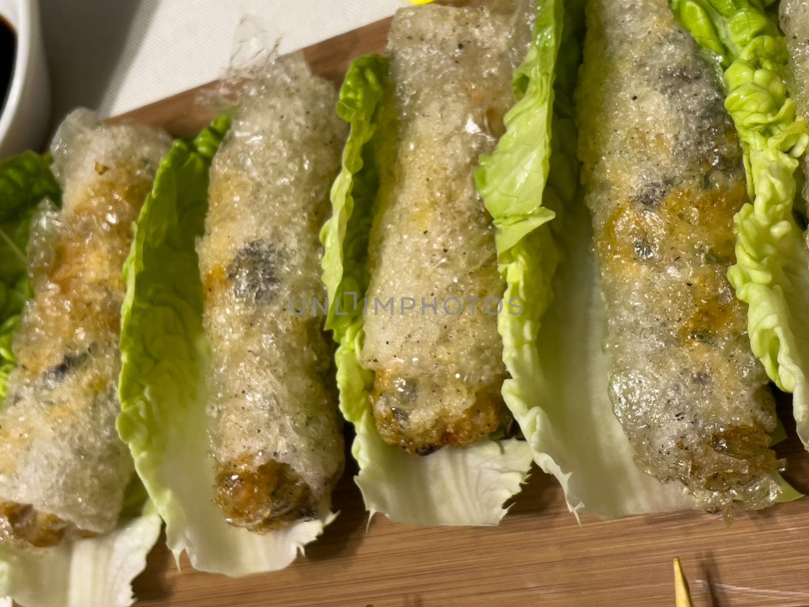 Asian nem dish on a bed of salad. High quality photo