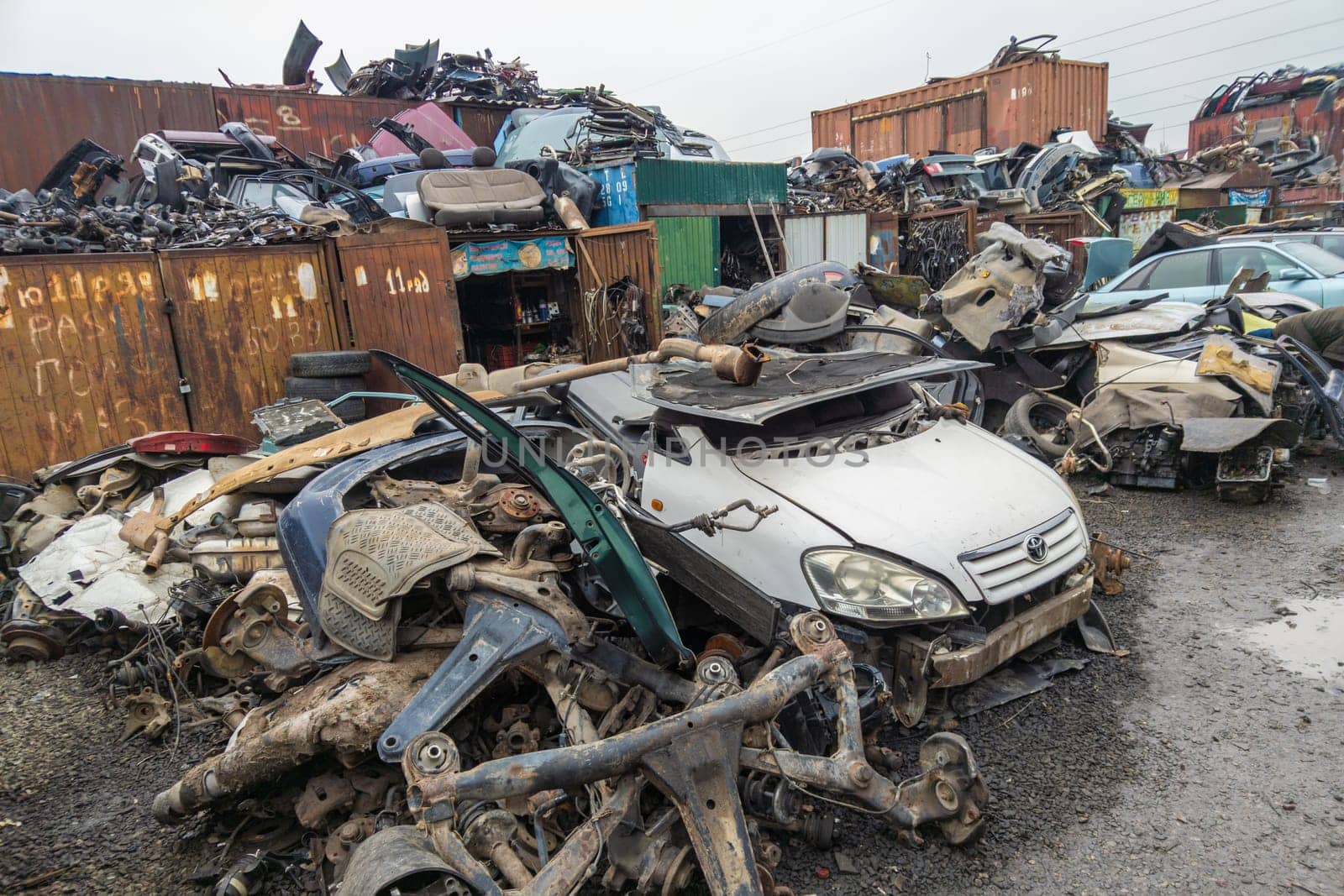 car parts at open air junkyard and used spare parts market in Kudaybergen, Bishkek, Kyrgyzstan - October 10, 2022