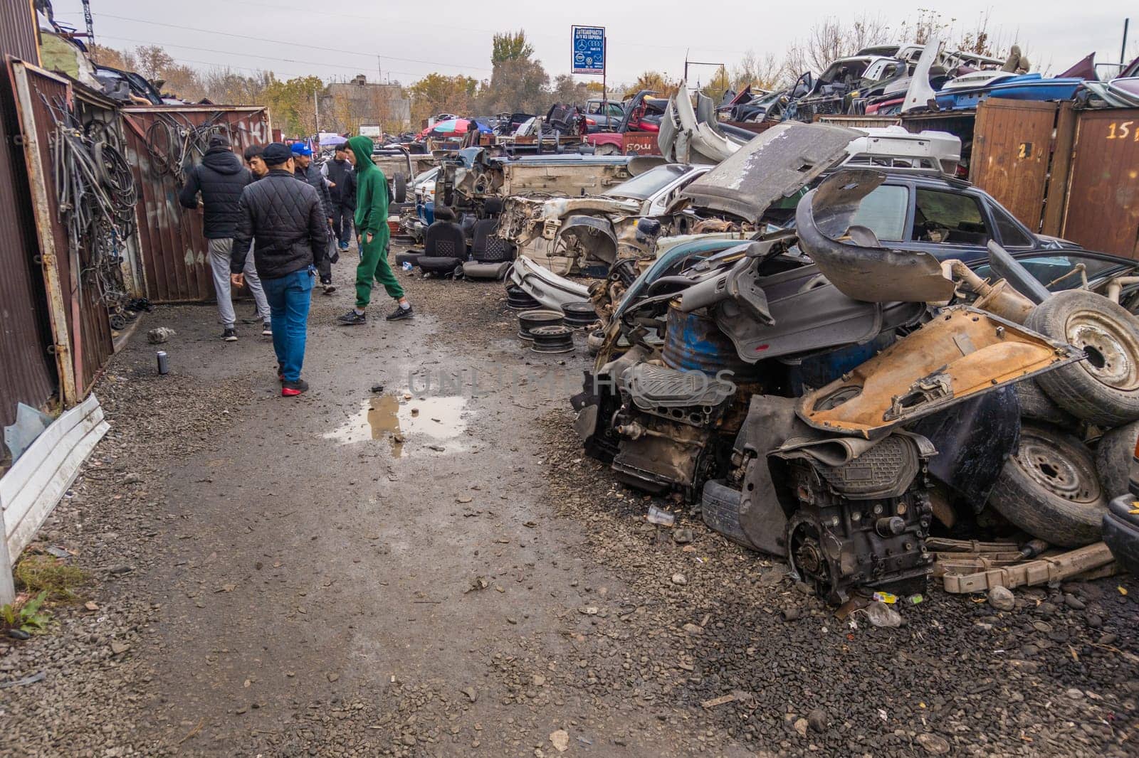 car parts at open air junkyard and used spare parts market in Kudaybergen, Bishkek, Kyrgyzstan - October 10, 2022