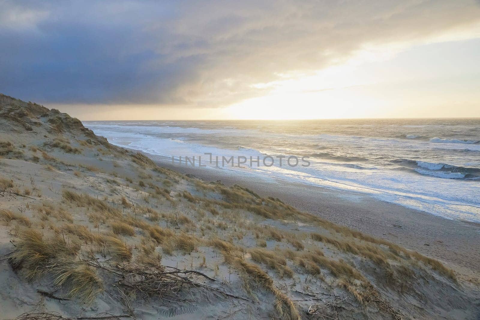 Storm on the North Sea at sunset in Denmark.