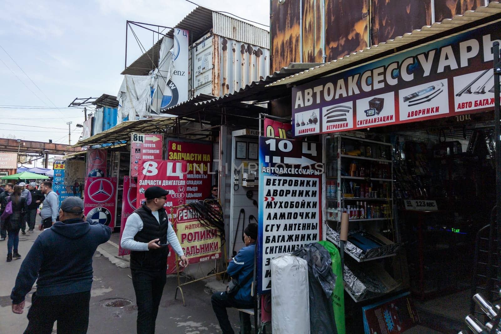 Car parts market shops in freight containers on Kudaybergen, Bishkek, Kyrgyzstan - November 5, 2022
