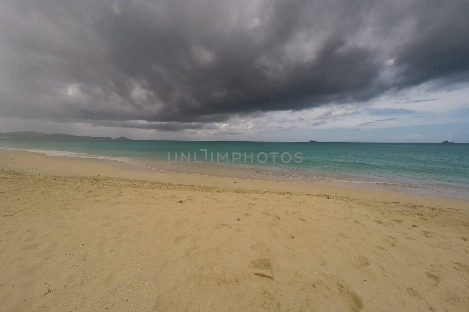 Caribbean beach with white sand, deep blue sky and turquoise water