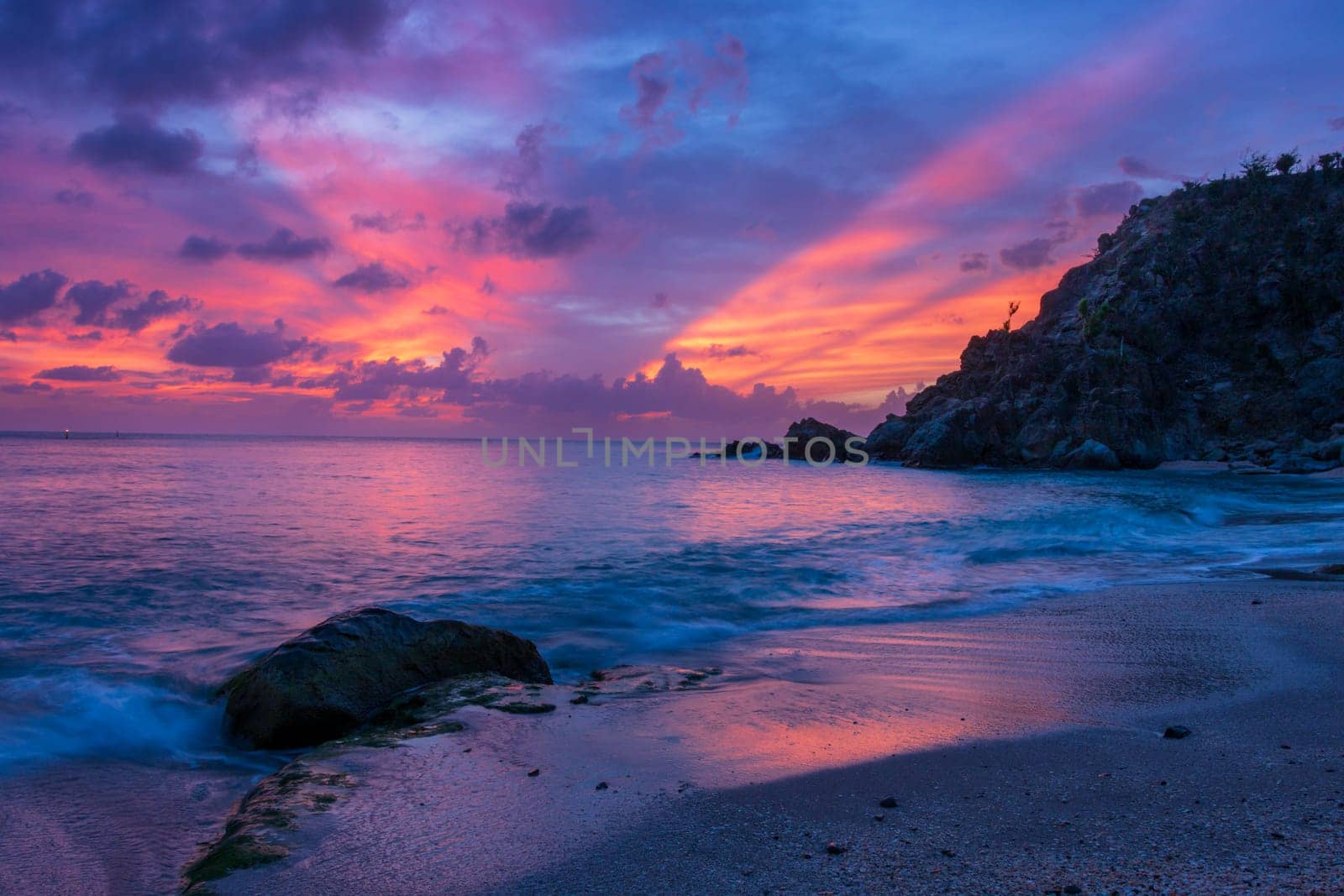 View of a peaceful sunset and waves on Shell Beach, Saint Barthélemy (St. Barts)