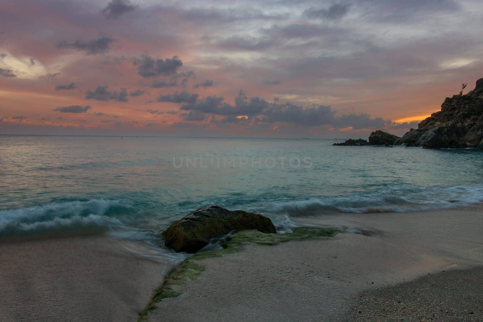 View of a peaceful sunset and waves on Shell Beach, Saint Barthélemy (St. Barts)