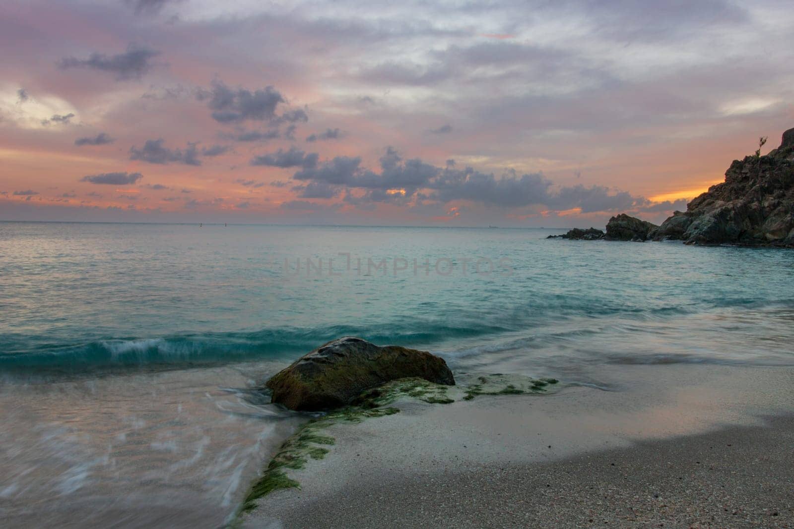 View of a peaceful sunset and waves on Shell Beach, Saint Barthélemy (St. Barts)