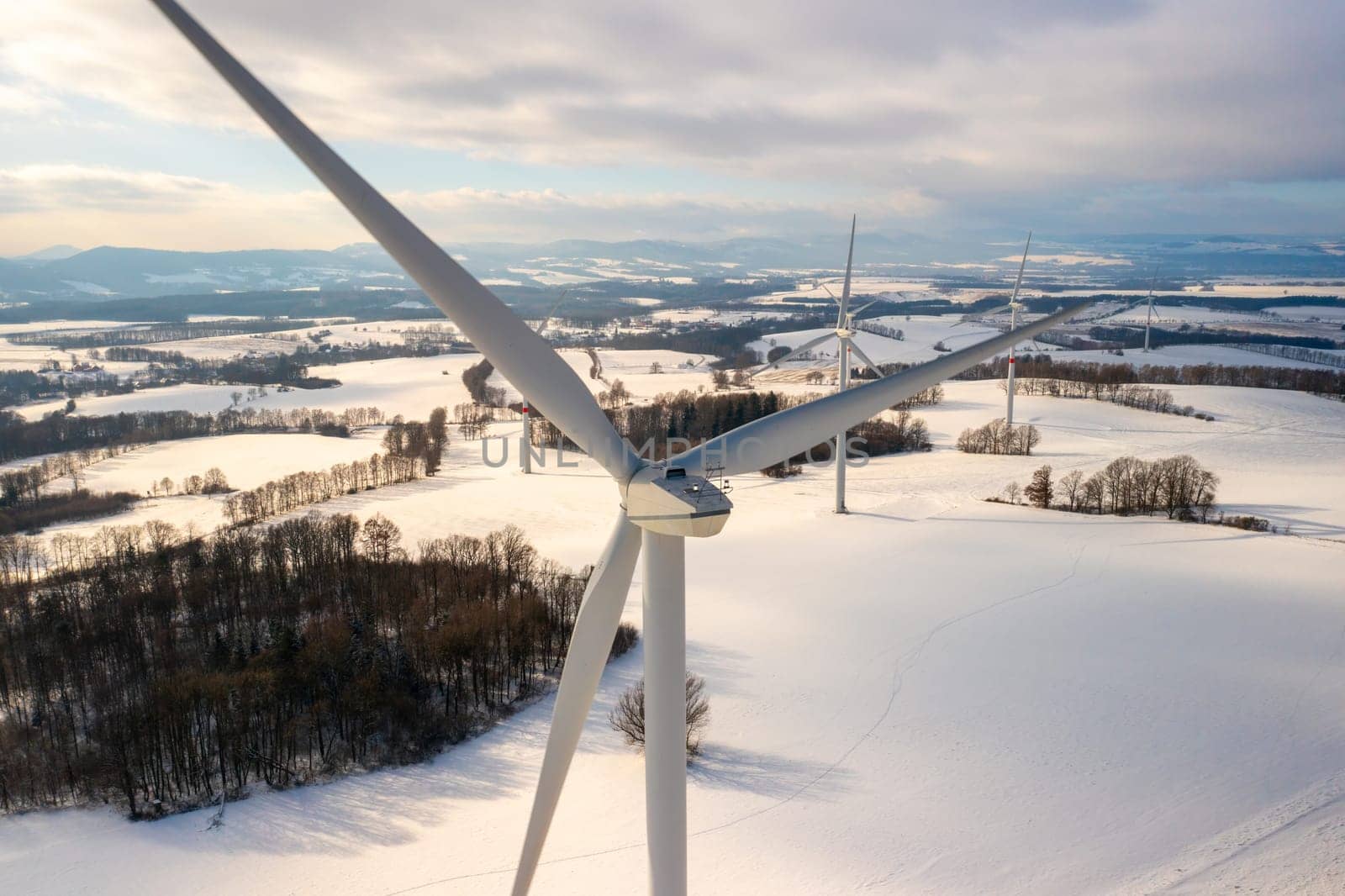 Wind turbines for production green electricity in a winter field