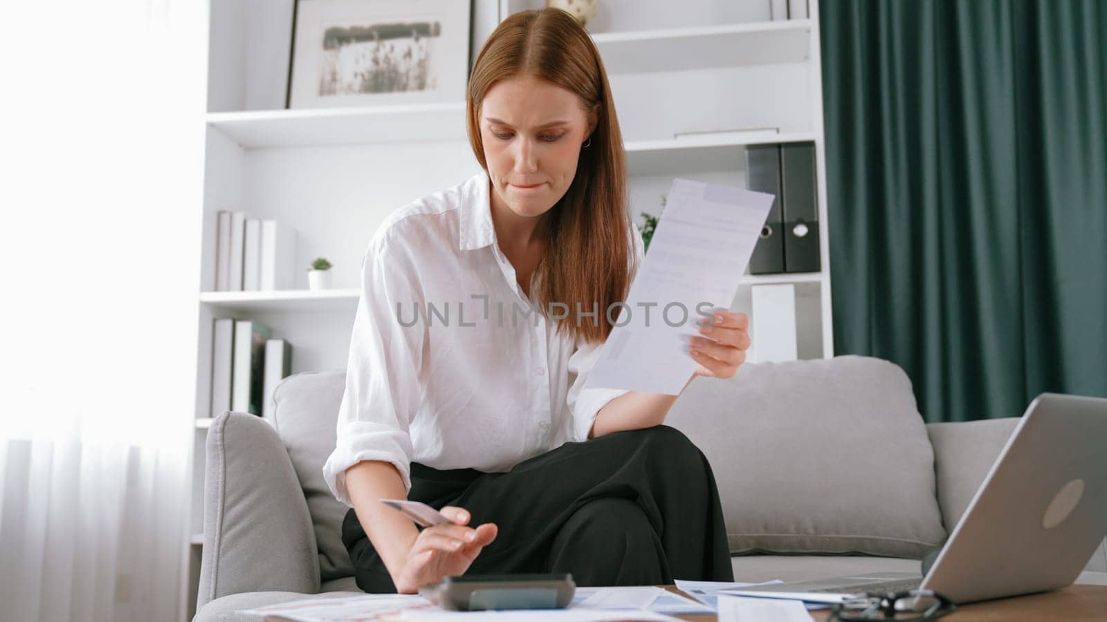 Stressed young woman has financial problems credit card debt to pay. Prim by biancoblue