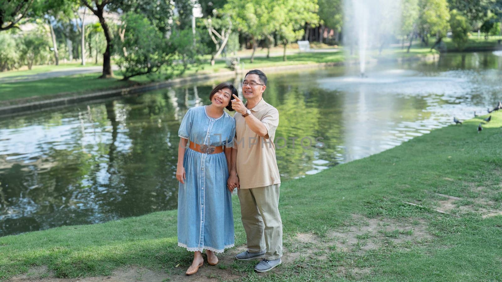 Retired Senior couple vacation holiday together at park. by itchaznong