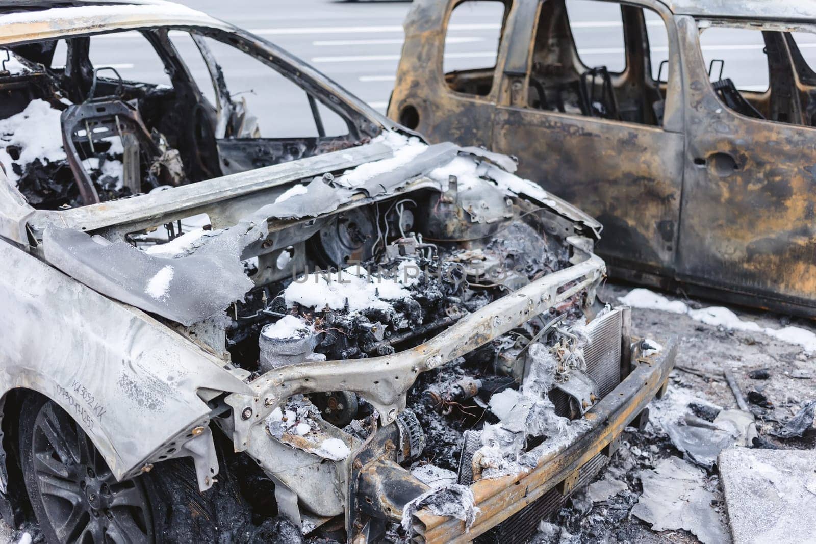 Kyiv, Ukraine - January 3, 2024: Burned civilians cars after a Russian's missiles attack by sarymsakov