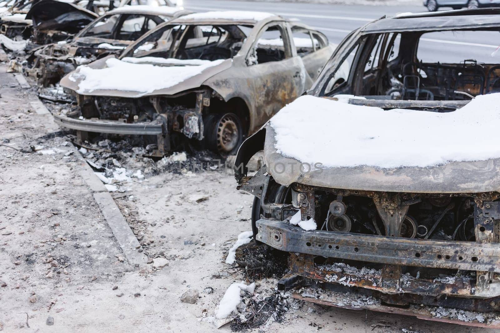 Kyiv, Ukraine - January 3, 2024: Burned civilians cars after a Russian's missiles attack.