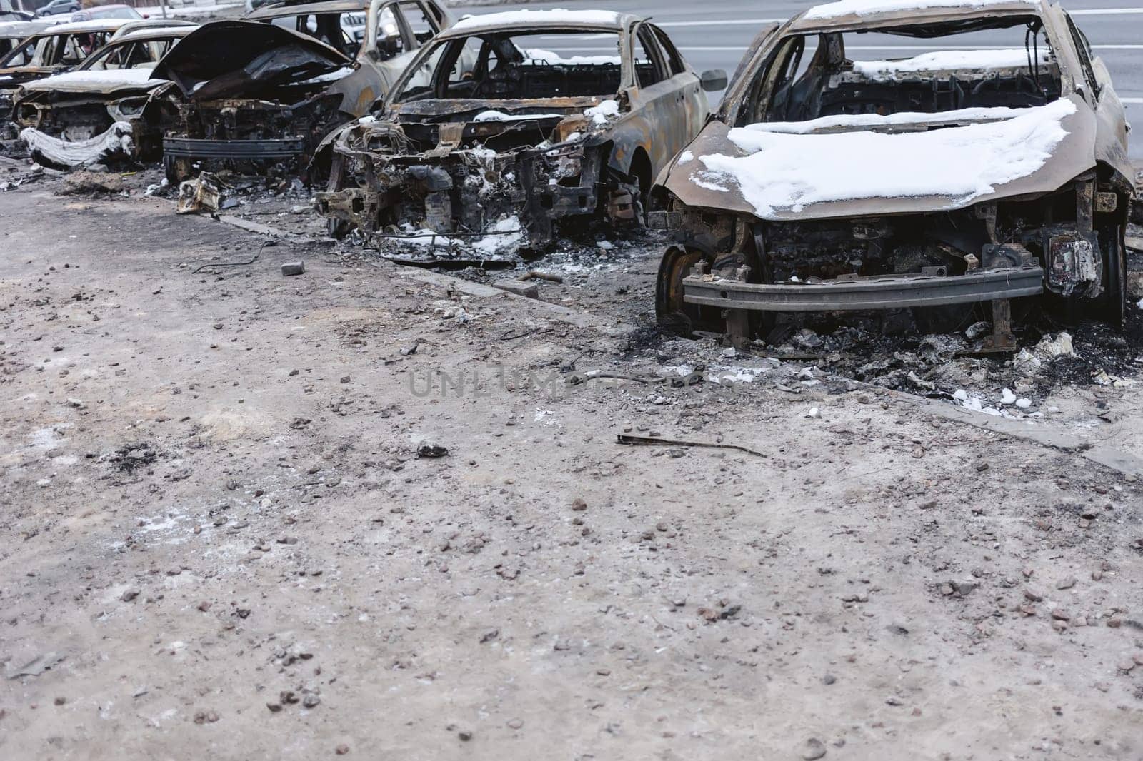 Kyiv, Ukraine - January 3, 2024: Burned civilians cars after a Russian's missiles attack.