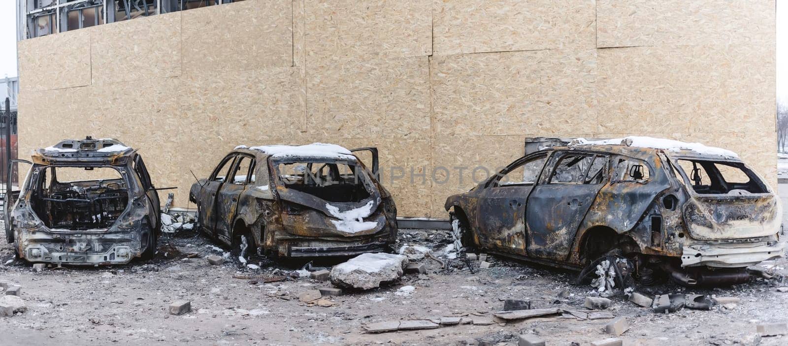 Kyiv, Ukraine - January 3, 2024: Burned civilians cars after a Russian's missiles attack by sarymsakov