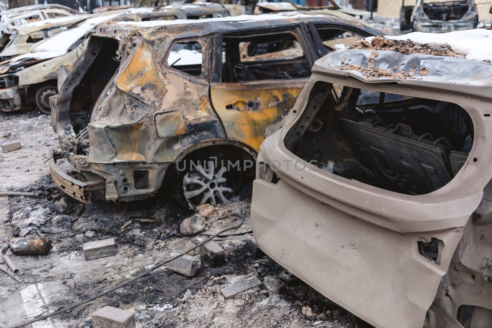 Kyiv, Ukraine - January 3, 2024: Burned civilians cars after a Russian's missiles attack.