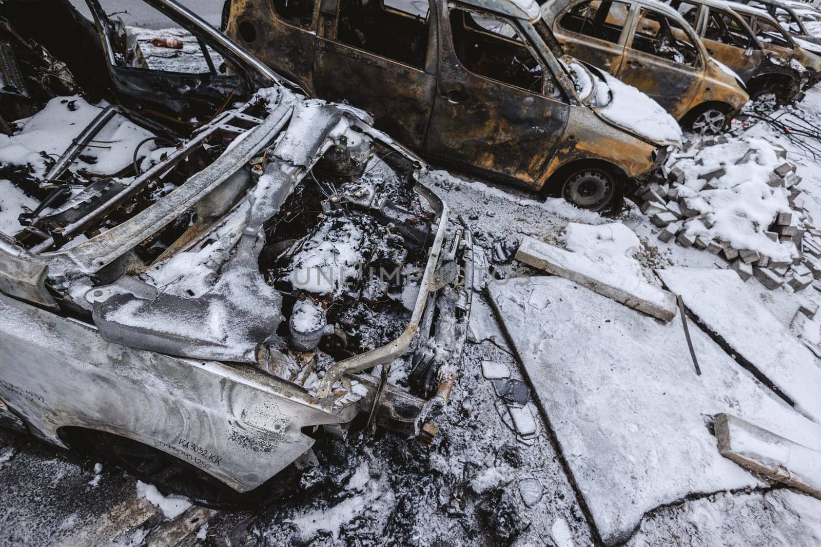 Kyiv, Ukraine - January 3, 2024: Burned civilians cars after a Russian's missiles attack by sarymsakov