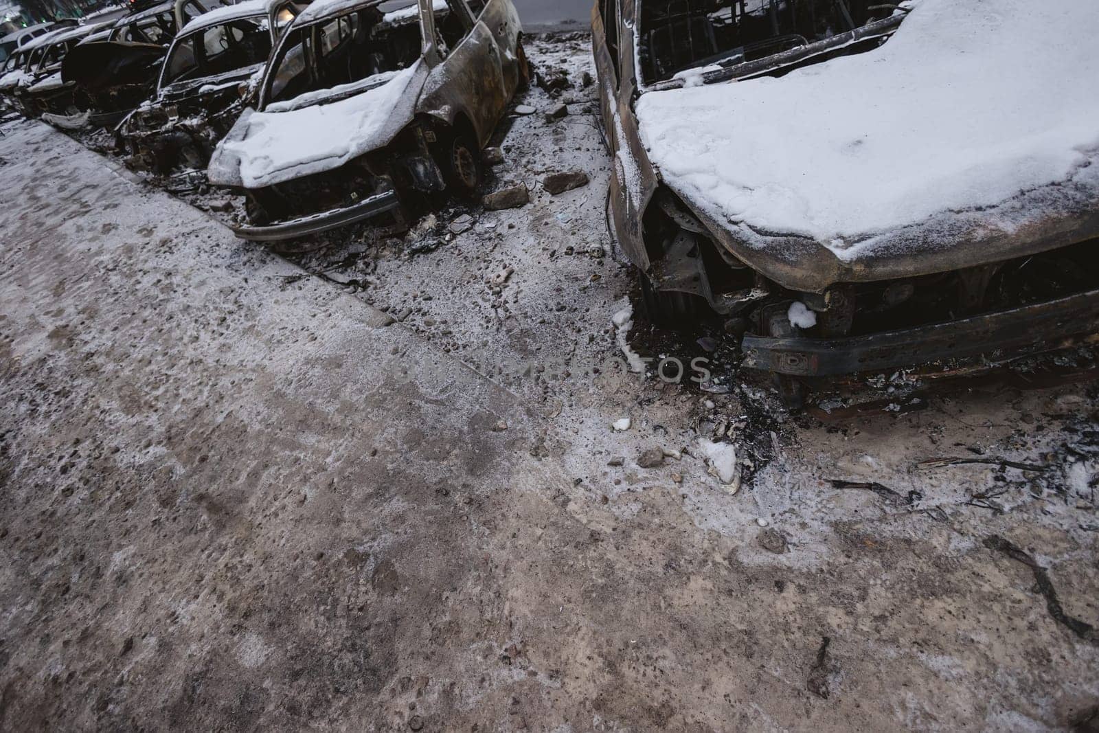 Kyiv, Ukraine - January 3, 2024: Burned civilians cars after a Russian's missiles attack.