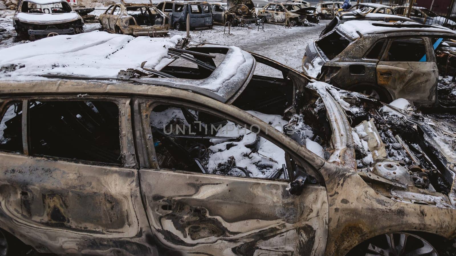 Kyiv, Ukraine - January 3, 2024: Burned civilians cars after a Russian's missiles attack.