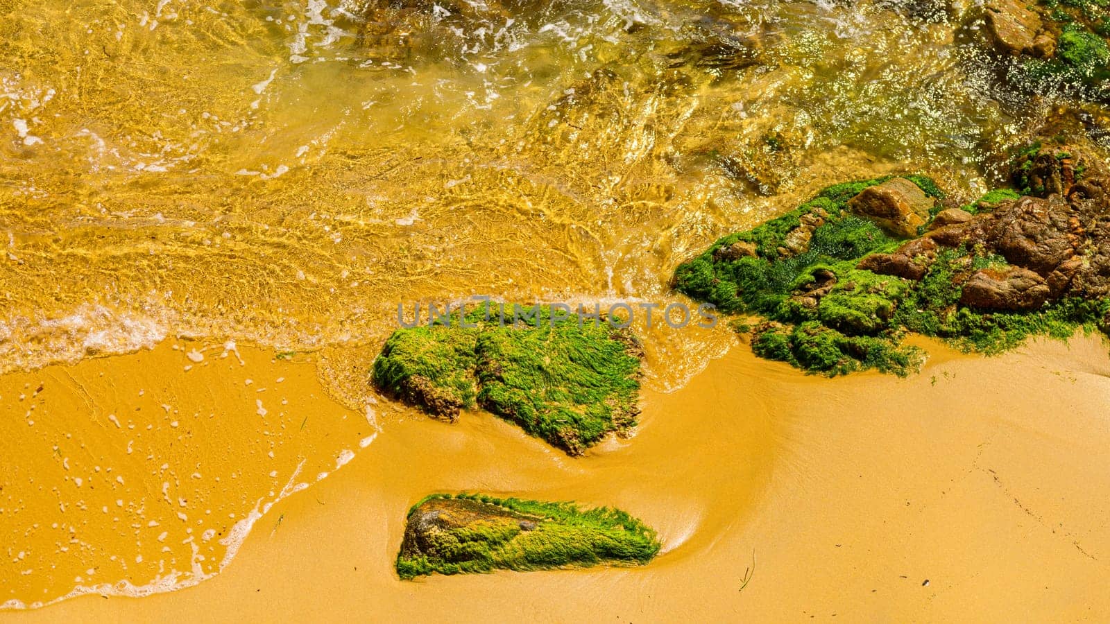 Waves hitting rocky shoreline by vladispas