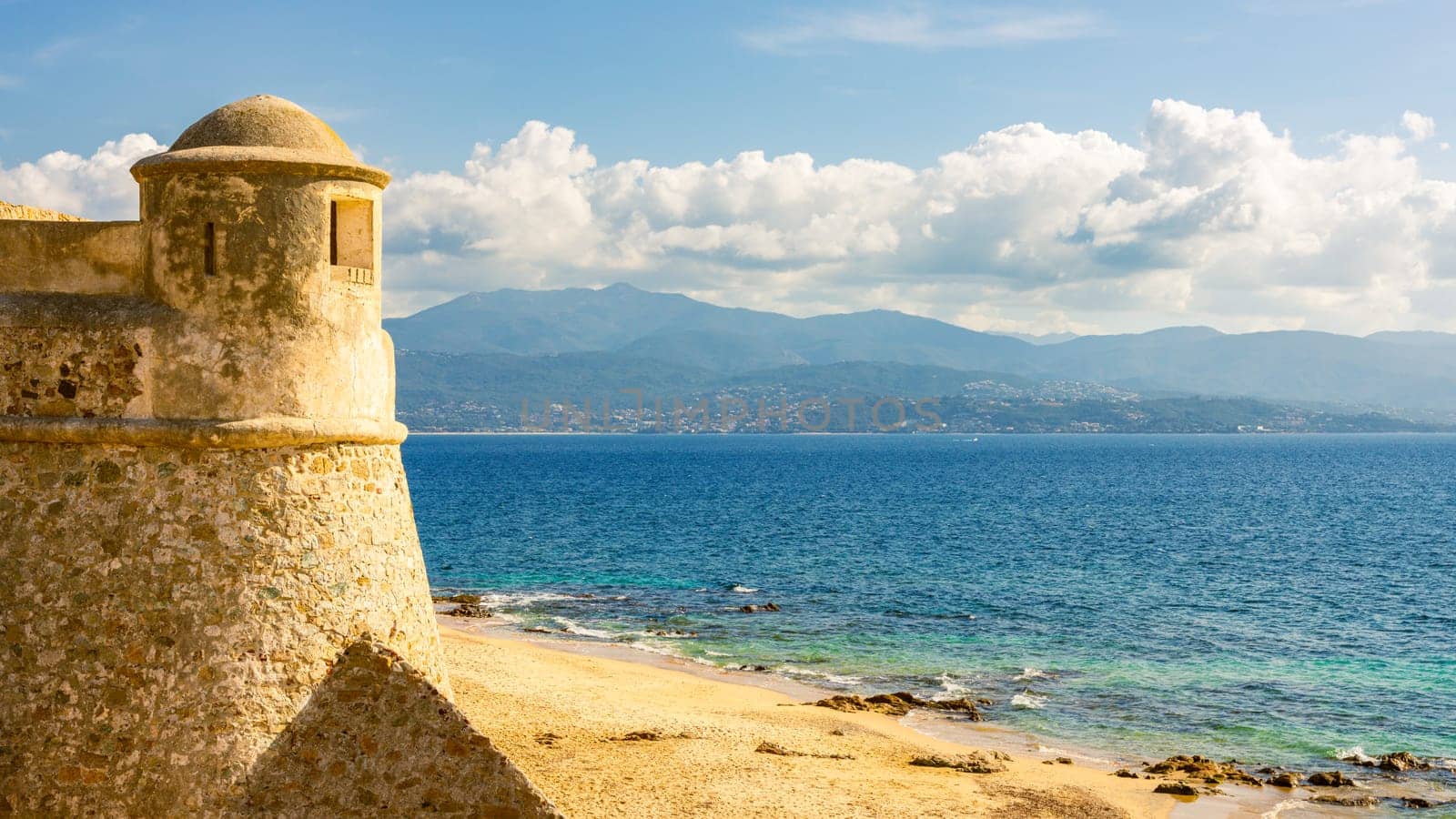 La Citadelle in Ajaccio, Old stone fortress and sandy beach in Corsica, France by vladispas