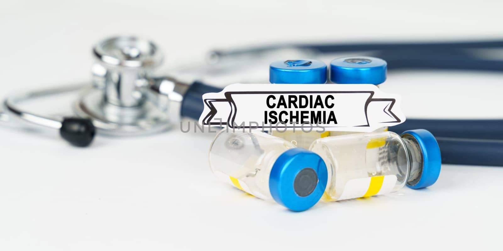 Medical concept. On the table there is a stethoscope, injections and a sign with the inscription - cardiac ischemia