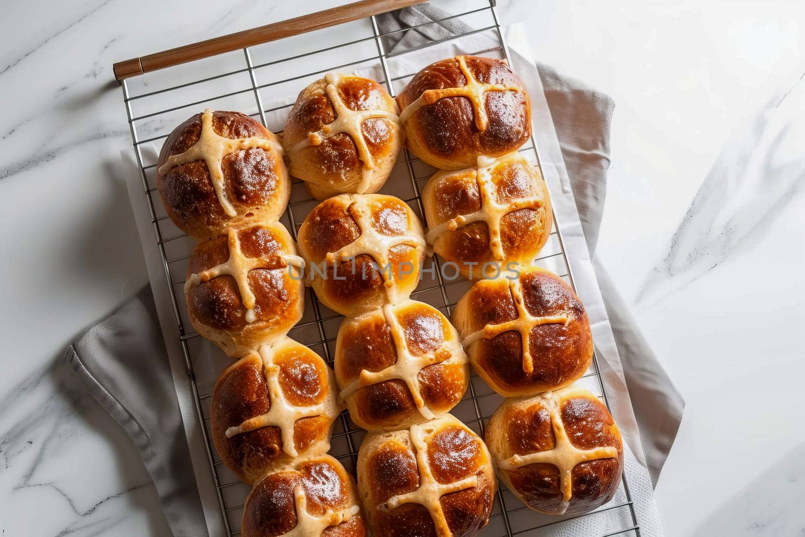 Traditional Easter hot cross buns on a cooling rack. AI generated.