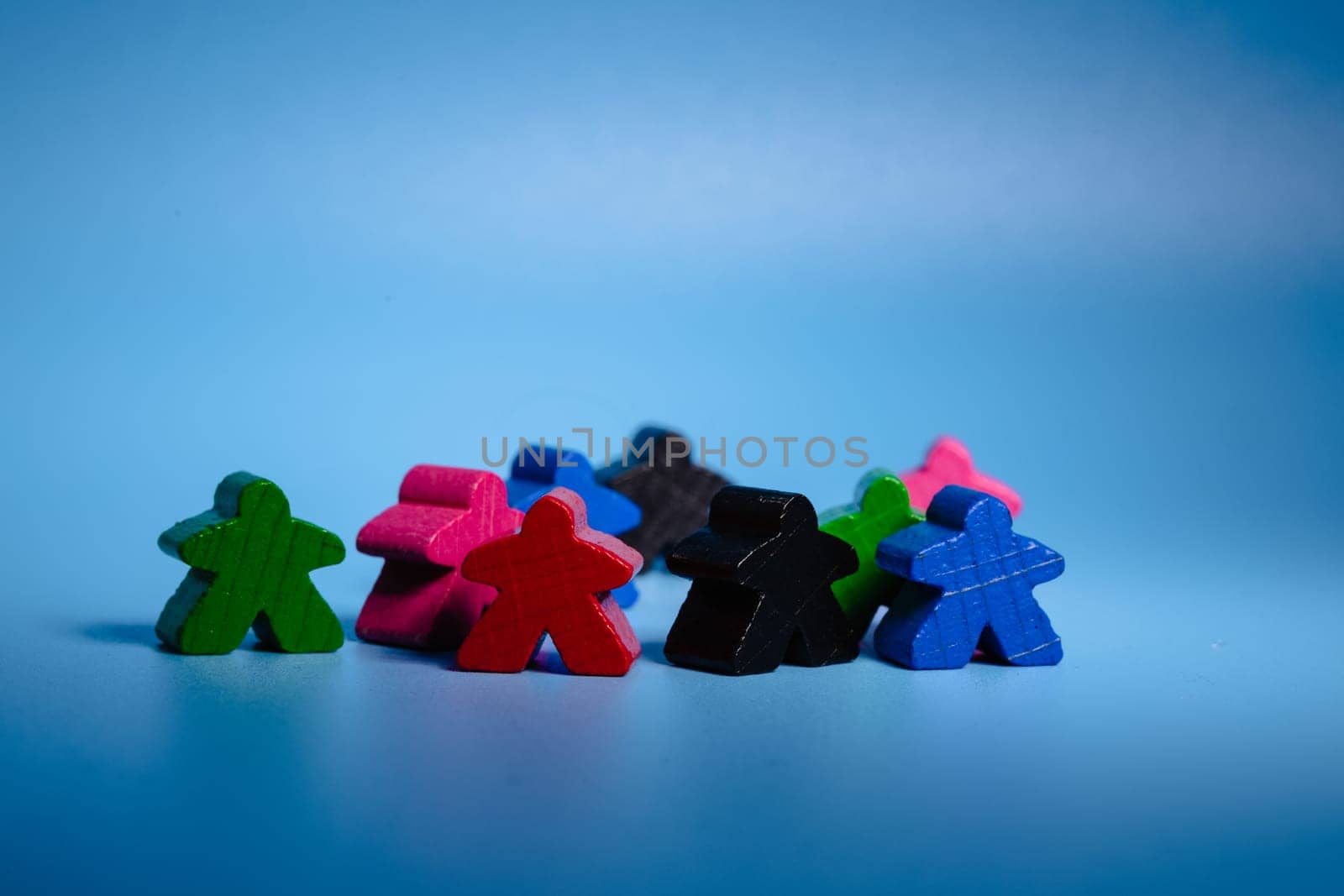 Group of Colorful Wooden Figures Sitting Together