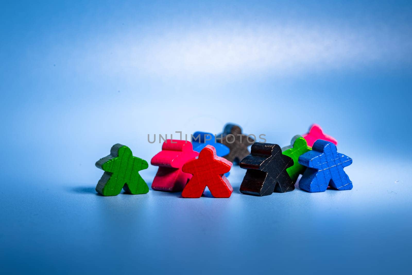 Group of Colorful Wooden Figures Sitting Together