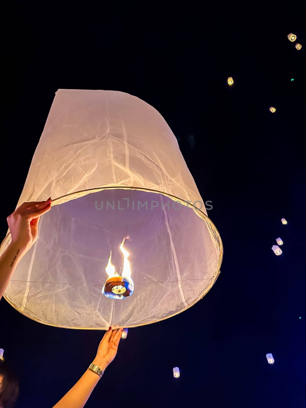 Sky lantern mass release event for Yee Peng and Loy Krathong festival in Chiang Mai, Thailand, south east asia