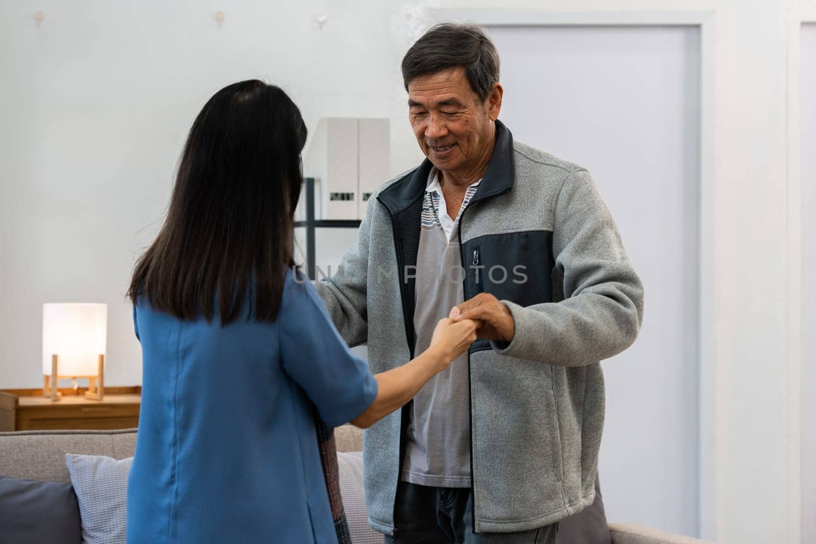 Holding hands, hug or happy old couple dancing for love, support or trust in marriage at home together.