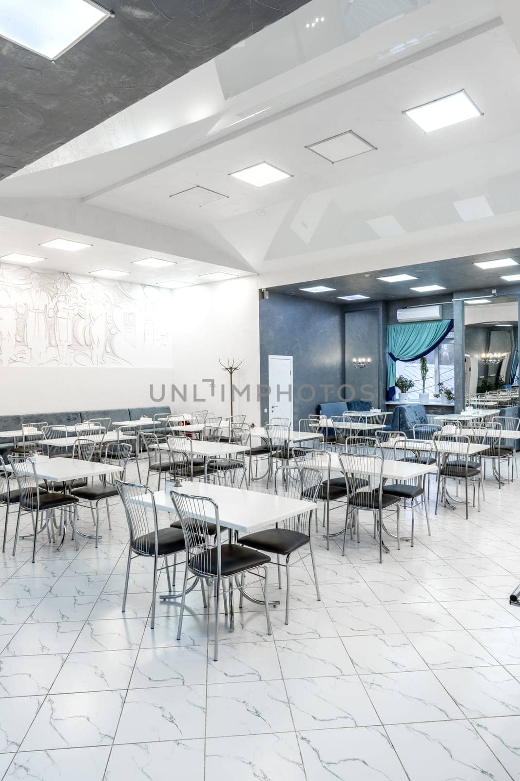 Interior of light colored canteen at the business center by Fabrikasimf